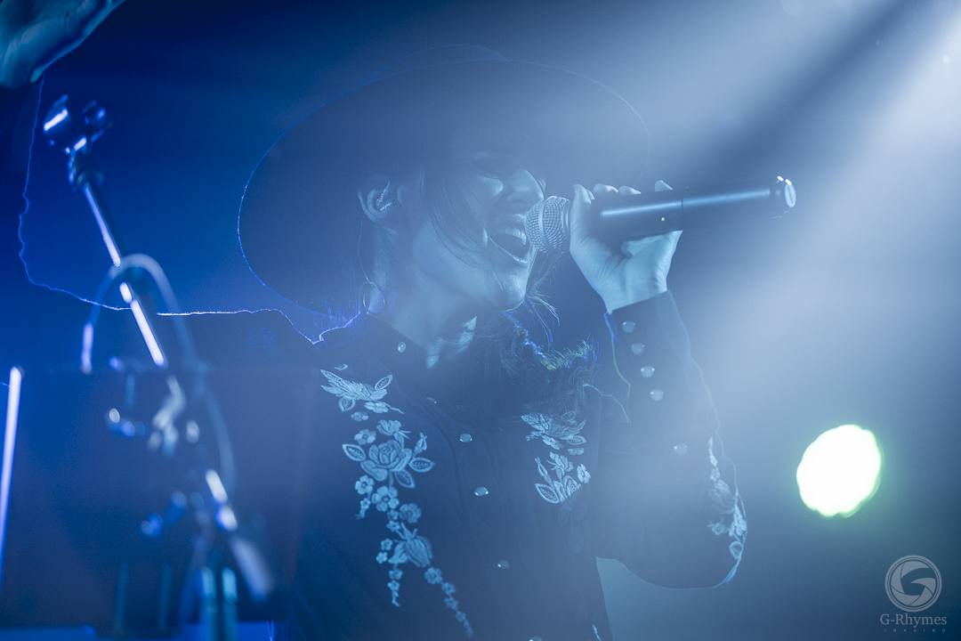 Vocalist under blue stage light